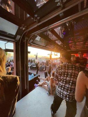 Garage doors open to dance floor