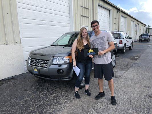 Happy couple with their new 2010 Land Rover!