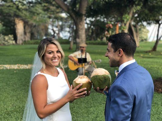 Bride & Groom enjoying a fresh coconut while being serenaded by Jamie Lawrence at Olowalu Plantation House