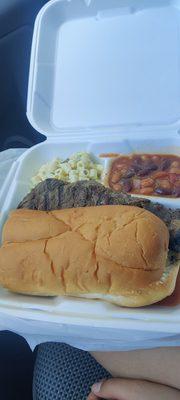 Ribeye steak sandwich beans and macaroni salad