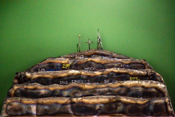 Decoration: miniature model of local mountain scenery which sits high on a shelf