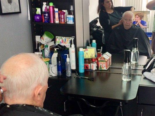 Tammy giving Grandpa a haircut