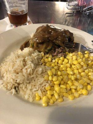 Chopped steak with jalapeño, onions, mushrooms and gravy, along with fiesta rice and corn.