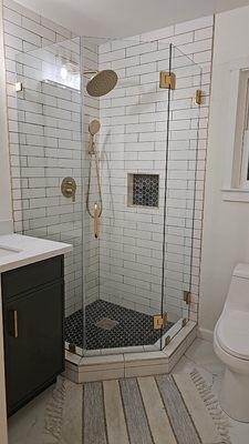 A neo angle frameless shower enclosure installed in downtown