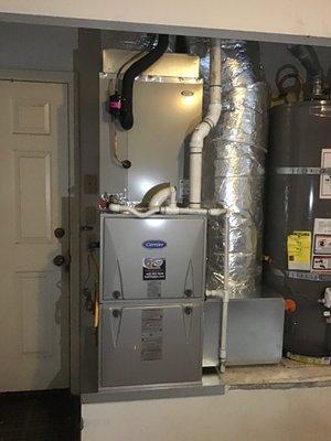 New High Efficiency Gas furnace in garage. With two stage operation this furnace is very quiet.