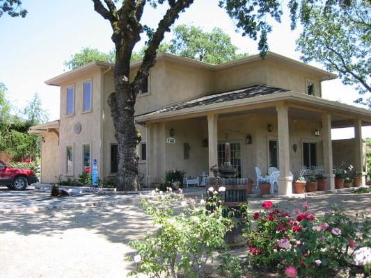 The tasting room is located right next to the winery, with beautiful views, a picnic area, and rose garden.