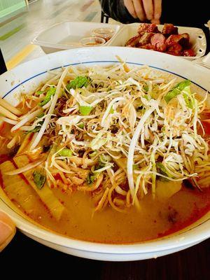 Chicken Kha Boun...best value at $8 and the bowl is HUGE! The veggie mix is legit when they give you banana blossom.