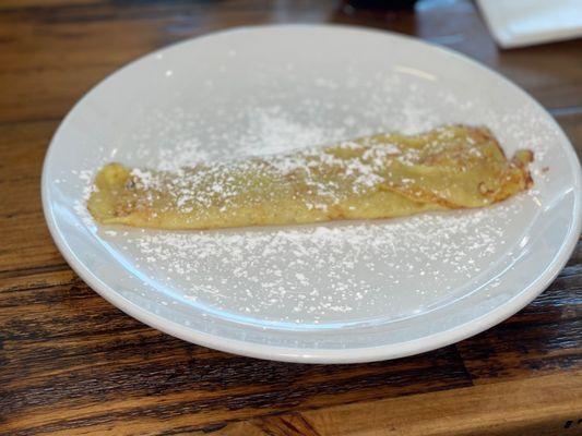 Crepe with powdered sugar.