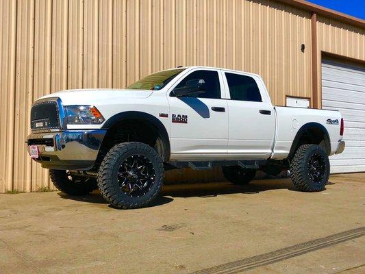 2016 Ram 2500 with a Rough Country 5" Lift Kit, 20x10 Fuel Wheels wrapped in 35" Toyo MT tires.