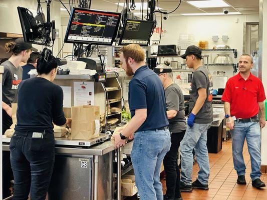 Happy employees in the kitchen. Teamwork