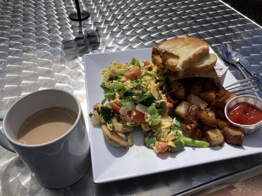 Decaf coffee, veggie scramble with home fries and toast.