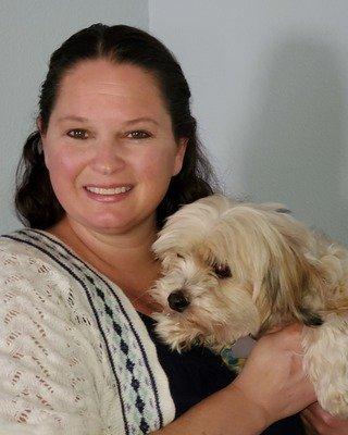 Our Assistant Director, Gale Cader, and her therapy dog, Chip