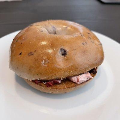 Blueberry bagel with strawberry spread