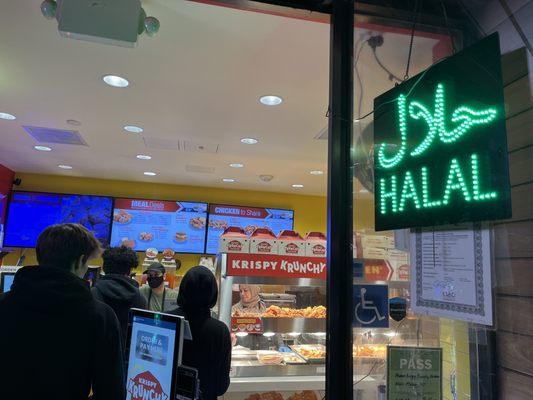 Halal sign is clearly visible outside with halal certificates