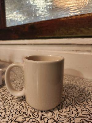 Coffee mug and retro print table top