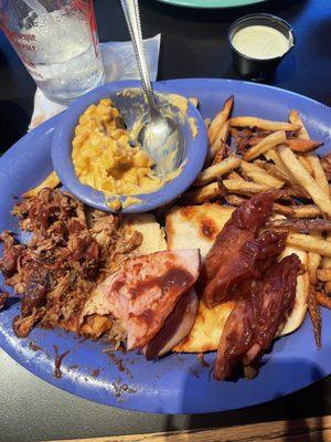 Cheesy Corn Bake, House Fries, Double Smoked Ham, Smoked Hot Link Sausage, Slow Smoked Pulled Pork