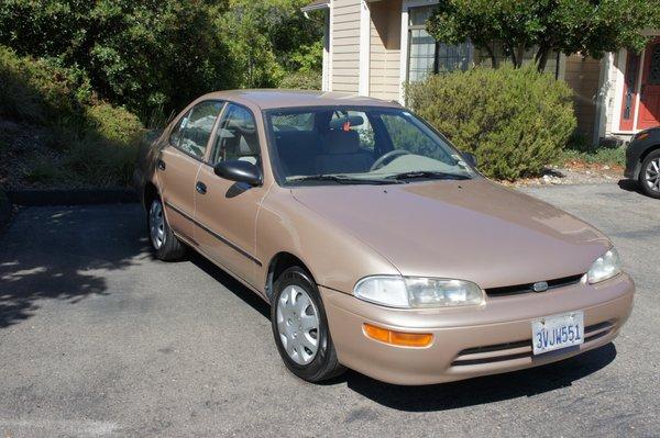 1996 Geo Prizm, new hubcaps, new tires.  29 year old car looks brand new after Maaco bodywork and painting.
 Thank you, Aamir and crew.