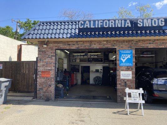 Photo of the inside of the smog shop's garage.