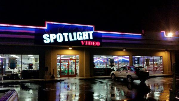 Front of Spotlight at night.