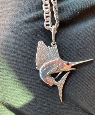 My 4 year old customized  sailfish pendant with a red ruby eye on an anchor chain