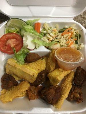 Pork rinds, yuca, salad, slaw