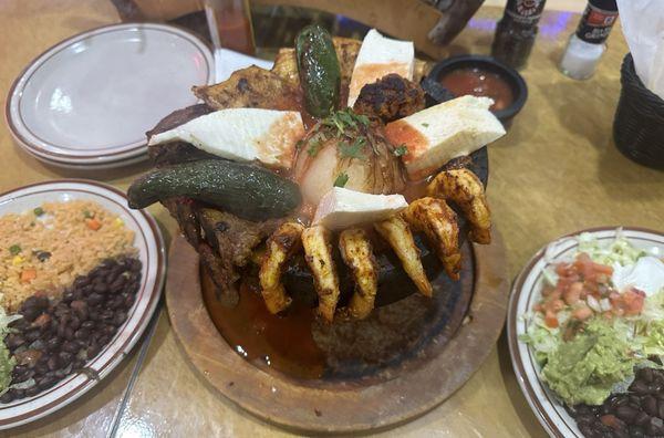 Molcajete for two with beef fajita, chicken, shrimp, sausage & queso fresco.