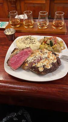 Med Rare Blue cheese Ribeye with a flight.