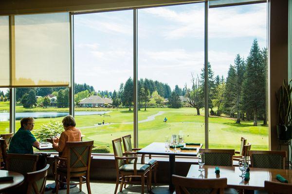 Floor-to-ceiling windows inside Embers Restaurant overlook our gorgeous golf course and natural wetlands.