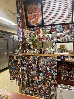 The front of the store filled with pictures of everyone who's been to the store within the past 20 years!