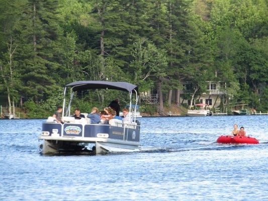 Fun with the pull-behind tube Maine Boat Rental LPG Graduation Party Jun2020