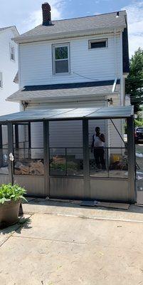 Installed Sojag Charleston 10 ft. x 13 ft. Aluminum Wall-Mounted Solarium in Dark Gray