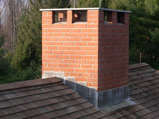 Chimney rebuilt, new flashing installed and Bluestone top added.