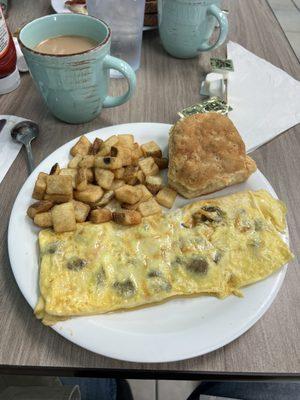 Sausage and cheddar omelette with hash browns and a biscuit and coffee