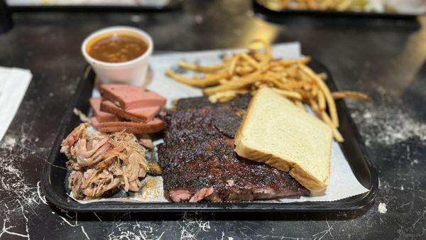 Ribs dinner with 2 meat add-ons, bologna and pulled pork, French fries, baked beans