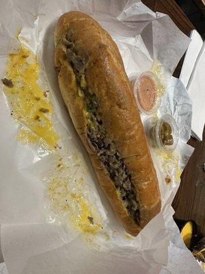 Large Cheesesteak with Cheese Wiz, Jalapeños, Onions. Cherry Peppers