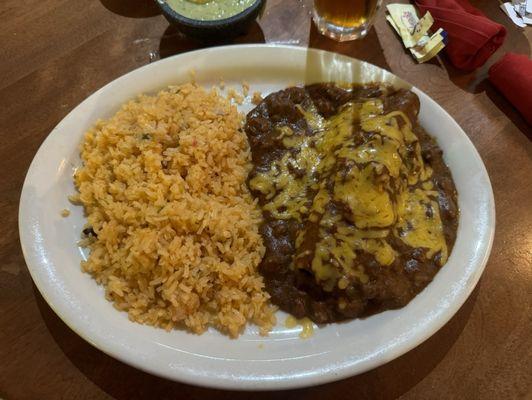 Berly's Burrito - flour tortilla filled w/ beef or chicken fajita meat, covered w/ chili con carne, topped w/ melted cheese with double rice