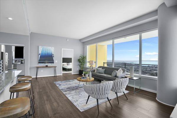 Open concept living room with large windows