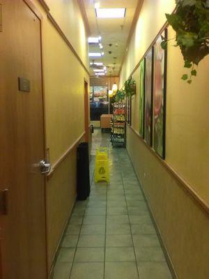 Looking down the hallway from the bathrooms.  It's a little cramped for a Subway, but the decor is still quite good.