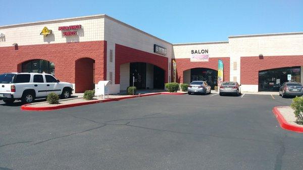 Wide shot of the corner of the strip mall