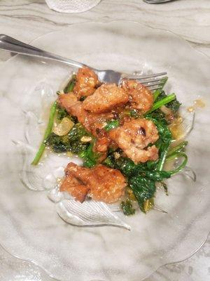 Sautéed gator on spinach and kale