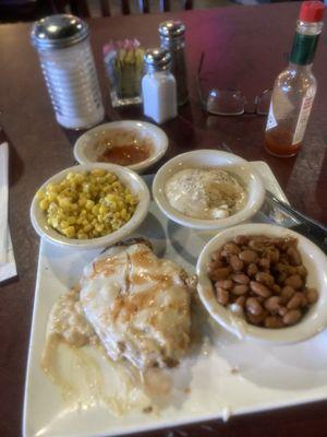 Chicken fried chicken, pinto beans, mashed potatoes and white gravy, corn