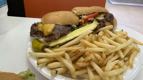 Beef deli sandwich with fries.