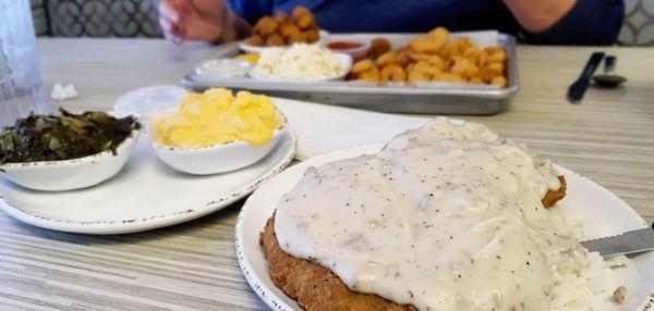 Lunch special: Chicken Fried steak, rice, mac-n-cheese, and turnip greens, $11.99. Whoa . . . huge!