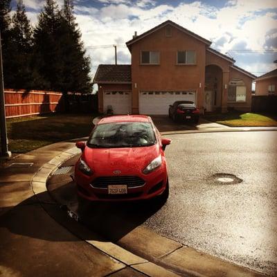 The Ford Fiesta I rented after some rain.