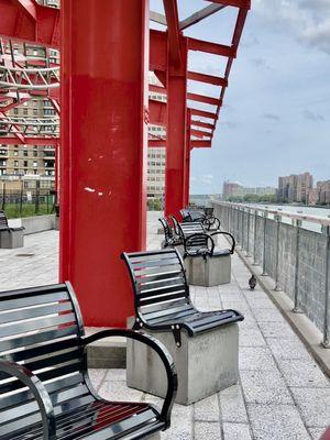 Seating area at Andrew Haswell Park along the East River