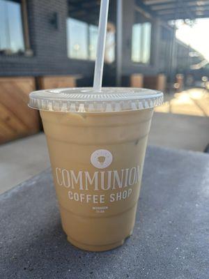 Iced Thai ginger latte with almond milk on the patio