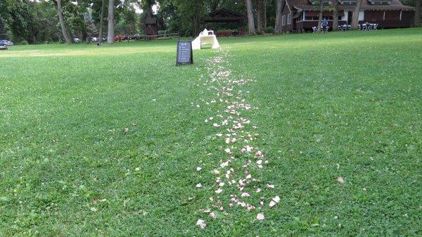 Rose petals led the way to the lakeside ceremony from the main lodge and parking area.