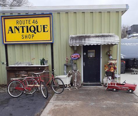 Vintage items such as bicycles, pedal firetruck, antique tub, wrought iron sign stands