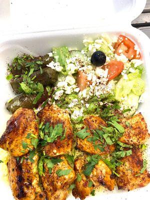 Shish tawook with rice and greek salad and grape leaves