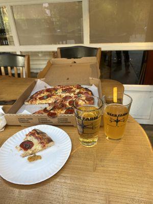 Honey bee pizza with pepperoni with apple ciders